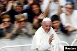 Pope Francis waves as he leaves at the end of a Jubilee mass in Saint Peter's Square at the Vatican, April 3, 2016.