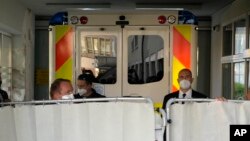 An ambulance carrying Czech President Milos Zeman arrives at the Military Hospital in Prague, Czech Republic, Oct. 10, 2021. 