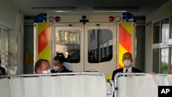 An ambulance carrying the Czech President Milos Zeman arrives at the Military Hospital in Prague, Czech Republic, Oct. 10, 2021. 