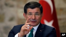 Turkish Prime Minister Ahmet Davutoglu speaks to a group of foreign reporters in Istanbul, Dec. 9, 2015. Turkey claims vindication for sending troops and tanks into Iraq, following an attack on a Turkish base training Iraqis who are fighting Islamic State.