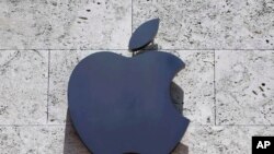 FILE - The Apple logo is seen at a store in Miami Beach, Florida, Aug. 8, 2017.