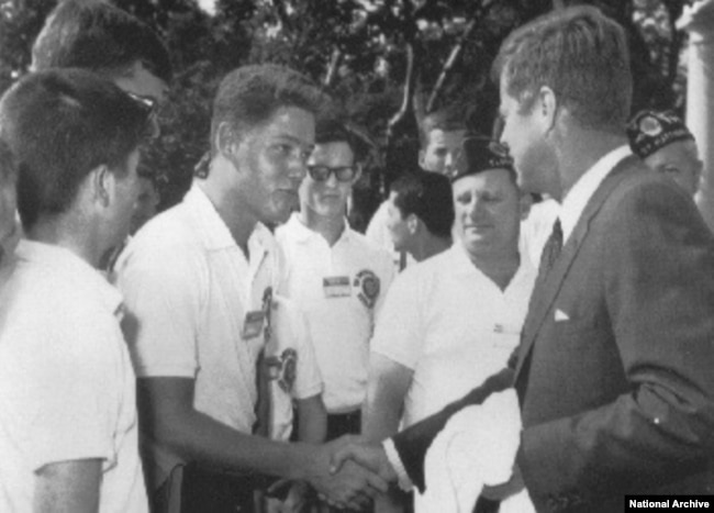 When he was in high school, Clinton met President John F. Kennedy at the White House. (National Archive