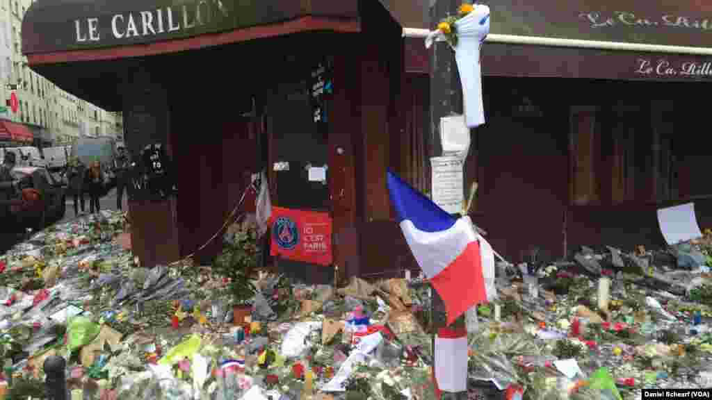 Memorials grow near Le Petit Cambodge and Le Carillon, which were the first restaurants hit in the multiple attacks across Paris Friday that left more than 120 people dead and hundreds wounded, Nov. 17, 2015.