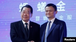 Founder and Executive Chairman of Alibaba Group Jack Ma (R) and Charoen Pokphand Group Chairman and CEO Dhanin Chearavanont attend an event of Ant Financial in Hong Kong, China November 1, 2016. 