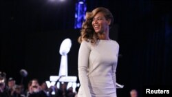Recording artist Beyonce walks offstage after the halftime show press conference ahead of the NFL's Super Bowl XLVII in New Orleans, Louisiana, Jan. 31, 2013.