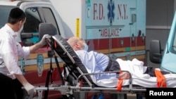 A patient arrives outside Maimonides Medical Center, as the spread of the coronavirus disease (COVID-19) continues, in the Borough Park area of Brooklyn, New York, U.S., September 25, 2020. 