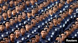 FILE - Members of Malaysia's maritime forces march during National Day celebrations marking the 56th anniversary of the country's independence, at Independence Square in Kuala Lumpur, August 31, 2013. 