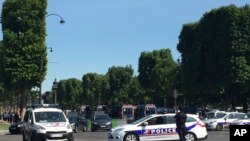 Police vehicles prevent the access to the Champs Elysees avenue in Paris, France, June 19, 2017. Paris officials say : Suspected attacker 'downed' after driving into police car on Champs-Elysees. 