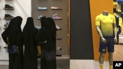 Saudi women shop at a mall in Riyadh. Women across Saudi Arabia marked a historic milestone Saturday, both voting and running as candidates in government elections for the first time.