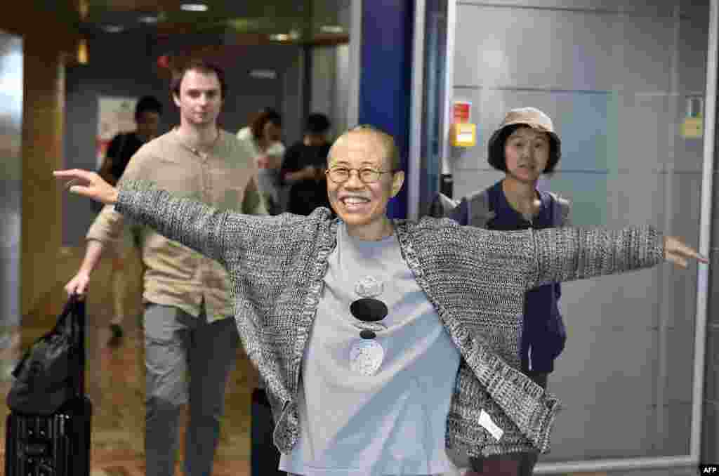 Liu Xia, the widow of Chinese Nobel dissident Liu Xiaobo, smiles as she arrives at the Helsinki International Airport in Vantaa, Finland. China allowed Liu Xia to fly to Berlin, ending an eight-year house arrest that had drawn intense international criticism and turned the 57-year old poet - who reluctantly followed her husband into politics two decades ago - into a tragic icon known around the world.