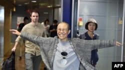Liu Xia, the widow of Chinese Nobel dissident Liu Xiaobo, smiles as she arrives at the Helsinki International Airport in Vantaa, Finland, on July 10, 2018.