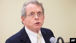 Ohio Attorney General Mike DeWine speaks during a news conference, Feb. 12, 2016, in Cincinnati. DeWine filed a lawsuit Wednesday against five drug prescription drug manufacturers, saying their deceptive practices fueled the opioid epidemic.