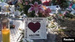 Flowers and mementos are seen the day students and parents came for voluntary campus orientation at the Marjory Stoneman Douglas High School, Feb. 25, 2018. 