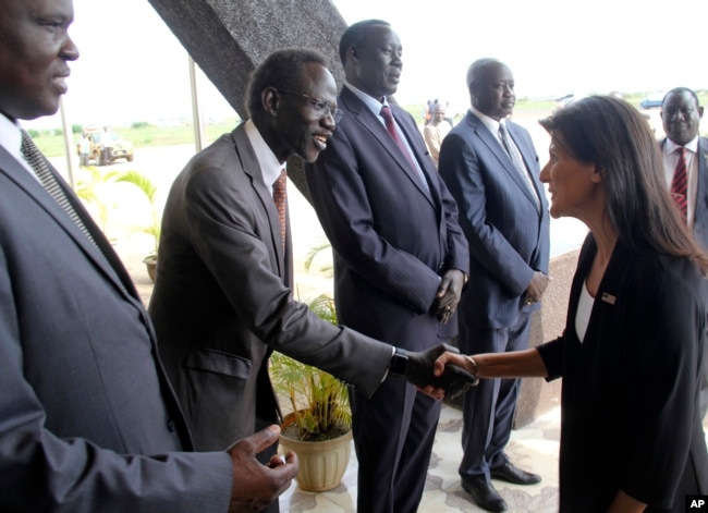 FILE - US Ambassador to the United Nations Nikki Haley, right, meets South Sudanese officials on her arrival in Juba, South Sudan, Oct. 25, 2017. The ambassador, on a three-country Africa visit, met earlier with President Salva Kiir over the country's long civil war.