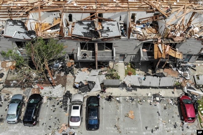 Debris is strewn about the front sidewalks of destroyed homes at the River's Edge apartment complex the day after a tornado struck the city, in Dayton, Ohio, May 28, 2019.