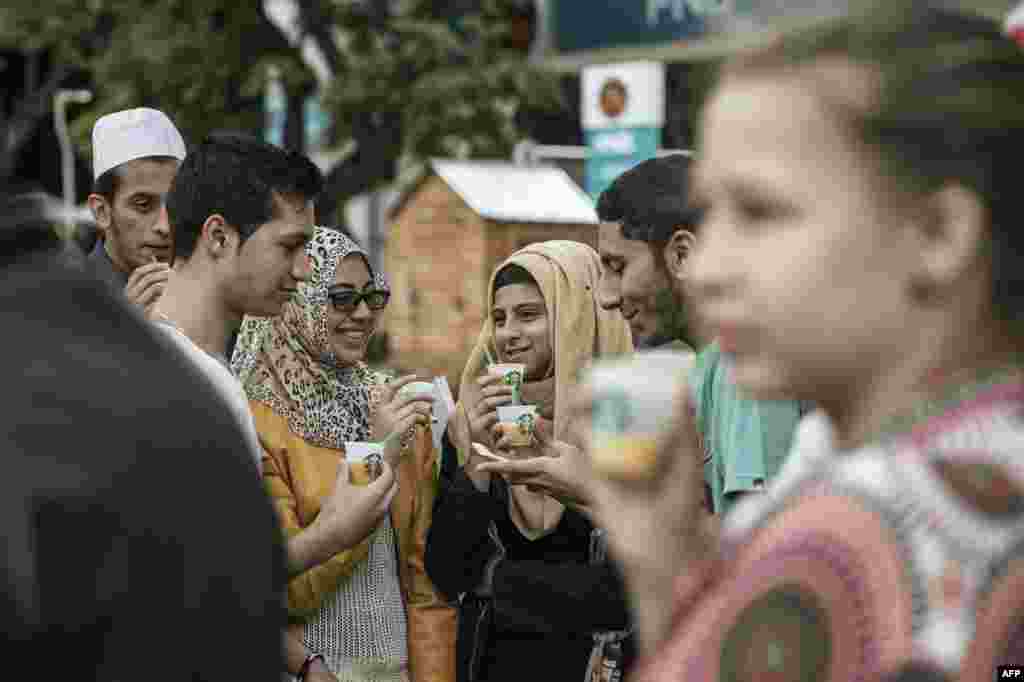 People take refreshments during the official opening of South Africa's first Starbucks store, also the US coffeehouse chain's first store in Sub-Saharan Africa, in Johannesburg.