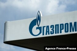 FILE - The logo of Russia's energy giant Gazprom is pictured at one of its gasoline stations in Moscow, April 16, 2021.