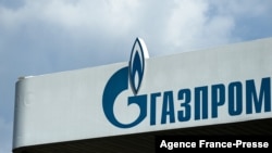 FILE - The logo of Russia's energy giant Gazprom is pictured at one of its gasoline stations in Moscow, April 16, 2021.