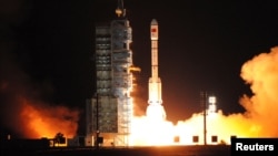 FILE - China's second experimental space laboratory lifts off from the launch pad in Jiuquan, Gansu province, China.