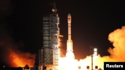 FILE - China's second experimental space laboratory lifts off from the launch pad in Jiuquan, Gansu province, China, Sept. 15, 2016. 