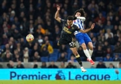 FILE - Newcastle United's Jacob Murphy, left, and Brighton's Marc Cucurella battle for the ball during a English Premier League match at AMEX Stadium in Brighton, England, Nov. 6, 2021.