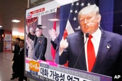 FILE - A TV screen shows pictures of U.S. President-elect Donald Trump, right, and North Korean leader Kim Jong Un, at the Seoul Railway Station in Seoul, South Korea, Nov. 10, 2016.
