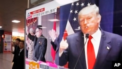 FILE - A TV screen shows pictures of U.S. President-elect Donald Trump, right, and North Korean leader Kim Jong Un, at the Seoul Railway Station in Seoul, South Korea, Nov. 10, 2016.