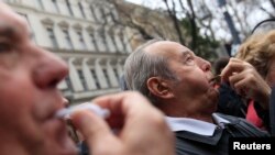 Opposition supporters react as Hungarian Prime Minister Viktor Orban speaks during Hungary's National Day celebrations, which also commemorates the 1848 Hungarian Revolution against the Habsburg monarchy in Budapest, Hungary, March 15, 2017. 