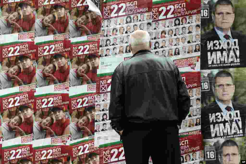 A man looks at pre-election posters of the Bulgarian Socialist&#39;s party in Sofia. Bulgarians will vote Sunday in early parliamentary elections. 