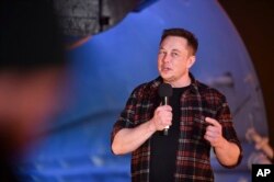 Elon Musk, co-founder and chief executive officer of Tesla Inc., speaks during an unveiling event for the Boring Co. Hawthorne test tunnel in Hawthorne, California., Dec. 18, 2018.