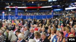 Delegates on the floor watching speakers at the Republican National Convention, Tampa, Florida, August 28, 2012. (J. Featherly/VOA)