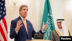 U.S. Secretary of State John Kerry, accompanied by Saudi Foreign Minister Adel al-Jubeir, right, speaks at joint news conference at Riyadh Air Base in Riyadh, Saudi Arabia, May 7, 2015. 