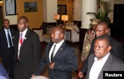 Burundi President Pierre Nkurunziza, center, is escorted on his way to the Julius Nyerere International Airport in Dar es Salaam, Tanzania, May 13, 2015.