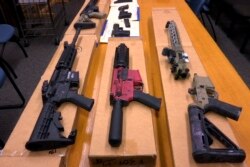 FILE - This Nov. 27, 2019, file photo shows "ghost guns" on display at the headquarters of the San Francisco Police Department in San Francisco.