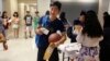 FILE - Weikang Nie, a finance graduate student from China, walks into an orientation for Chinese students at the University of Texas at Dallas in Richardson, Texas, Aug. 22, 2015.