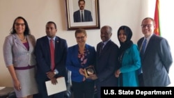 Chief of Mission Natalie E. Brown, far left, and Deputy Chief of Mission Stephen Bank, far right, pose with Rep. Joe Neguse, Rep. Karen Bass, Eritrean Minister of Foreign Affairs Osman Saleh and Rep. Ilhan Omar. The members of Congress were on an official visit to Eritrea.
