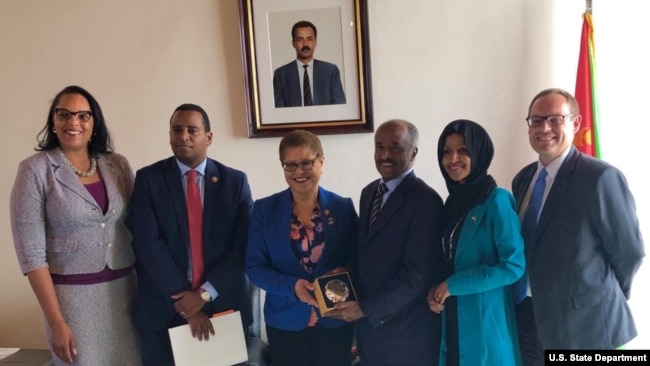 FILE - From left are Chief of Mission Natalie E. Brown, Rep. Joe Neguse, Rep. Karen Bass, Minister of Foreign Affairs Osman Saleh, Rep. Ilhan Omar and Deputy Chief of Mission Stephen Banks. Members of Congress were the first to visit Eritrea in 14 years.