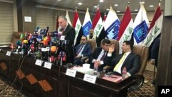 FILE - Kareem al-Tamimi, spokesman of Iraq's Independent High Electoral Commission announce the results of the country's Parliamentary elections early, May 19, 2018 in Baghdad.