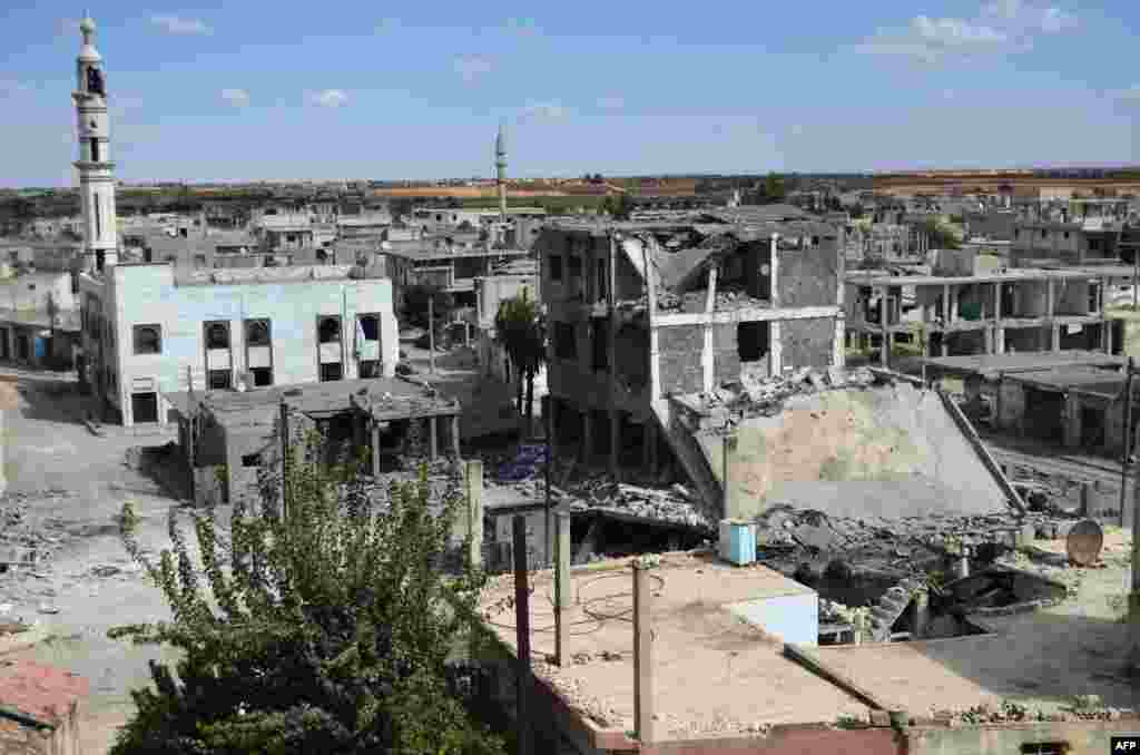 A picture taken on Sept. 30, 2015 shows a general view of deserted streets and damaged buildings in the central Syrian town of Talbiseh in Homs province.