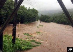 A photo provided by the County of Kauai shows flooding at Ala Eke near the town of Hanalei on the island of Kauai in Hawaii, Aug. 27, 2018.