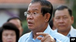 FILE - Cambodian Prime Minister Hun Sen speaks after his voting in a senate election at Takhmau polling station in Kandal province, southeast of Phnom Penh, Feb. 25, 2018. 