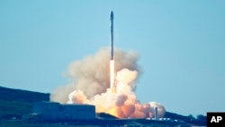 SpaceX's Falcon 9 rocket is launched launches at Vandenberg Air Force Base, Calif., Jan. 14, 2017. The two-stage rocket lifted off to place 10 satellites into orbit for Iridium Communications Inc.