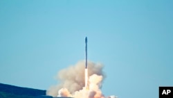 SpaceX's Falcon 9 rocket is launched launches at Vandenberg Air Force Base, Calif., Jan. 14, 2017. The two-stage rocket lifted off to place 10 satellites into orbit for Iridium Communications Inc.