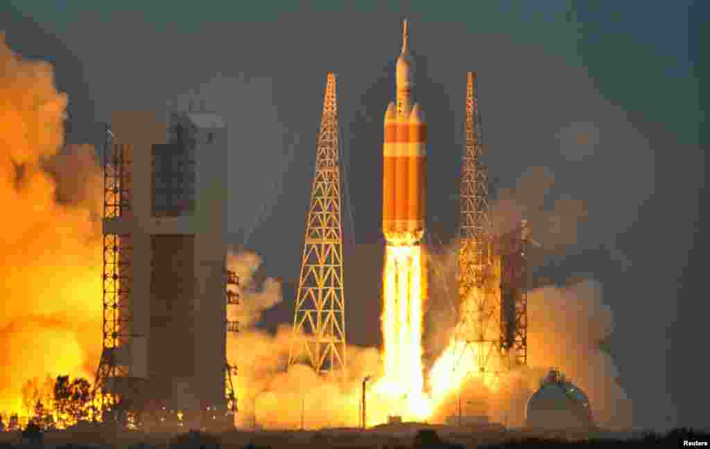 The Delta IV Heavy rocket with the Orion spacecraft lifts off from the Cape Canaveral Air Force Station in Cape Canaveral, Florida, Dec. 5, 2014.