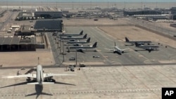 FILE - A view of Hamad International Airport (HIA) in Doha, Qatar, with parked Qatari planes, June 6, 2017.