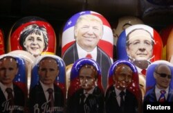 FILE - Painted matryoshka dolls, or Russian nesting dolls, bearing the faces of then-U.S. Republican presidential nominee Donald Trump and Russian President Vladimir Putin are displayed at a souvenir shop in central Moscow, Russia, Nov. 7, 2016.