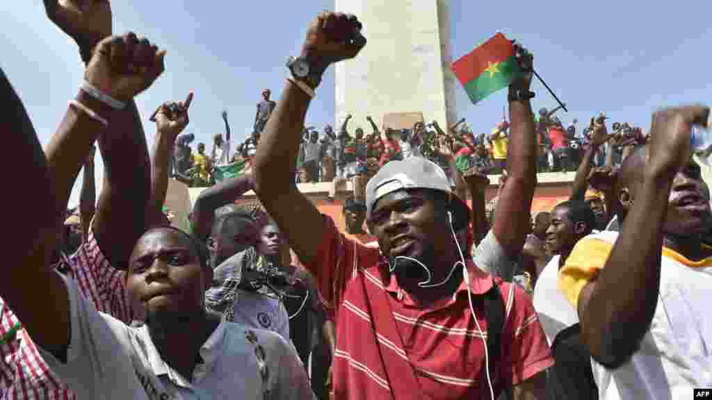 People celebrate in the capital Ouagadougou after Burkina Faso's embattled President Blaise Compaore announced he was stepping down, Oct. 31, 2014.