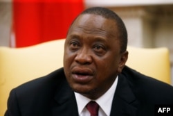 FILE - Kenya's President Uhuru Kenyatta speaks while meeting with U.S. President Donald Trump in the Oval Office at the White House in Washington, Aug. 27, 2018.