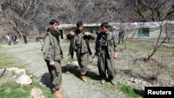 Kurdistan Workers Party (PKK) fighters stand guard at the Qandil mountains near the Iraq-Turkish border in Sulaimaniya, northeast of Baghdad, Iraq March 24, 2013.