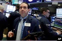 Trader Tommy Kalikas works on the floor of the New York Stock Exchange, Feb. 5, 2018.